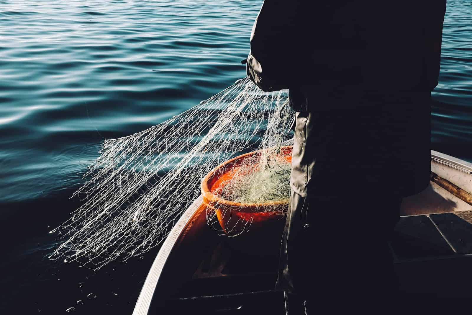 man holding a fishnet