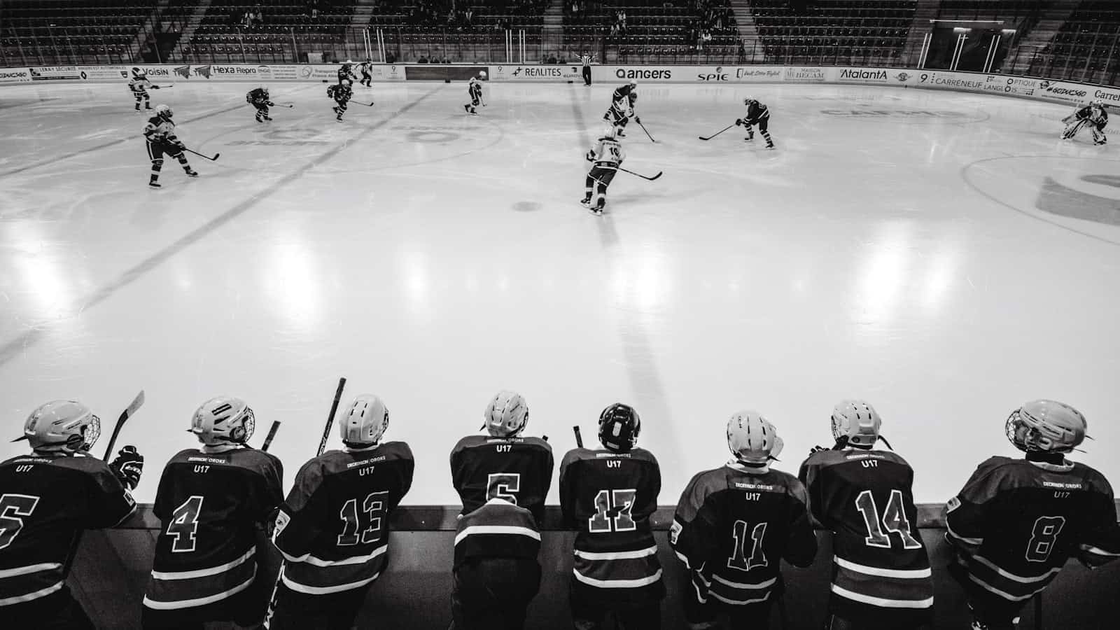 ice hockey players on ice hockey field