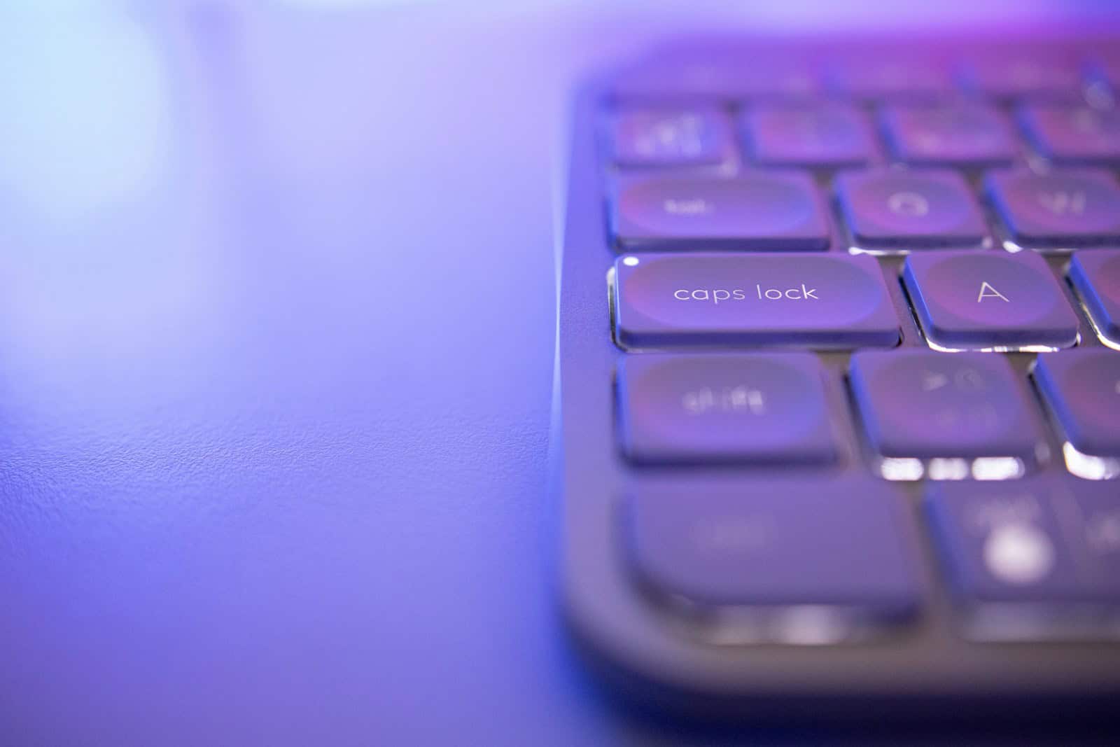 a close up of a purple keyboard on a table